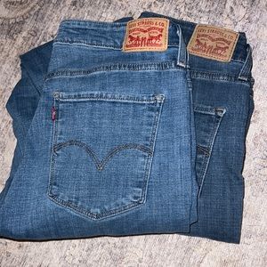 2 pairs of non-ripped Levi jeans
